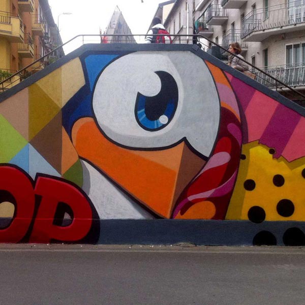A bridge on the Navigli River in Milan, Italy, painted with a street art mural by Pao. 