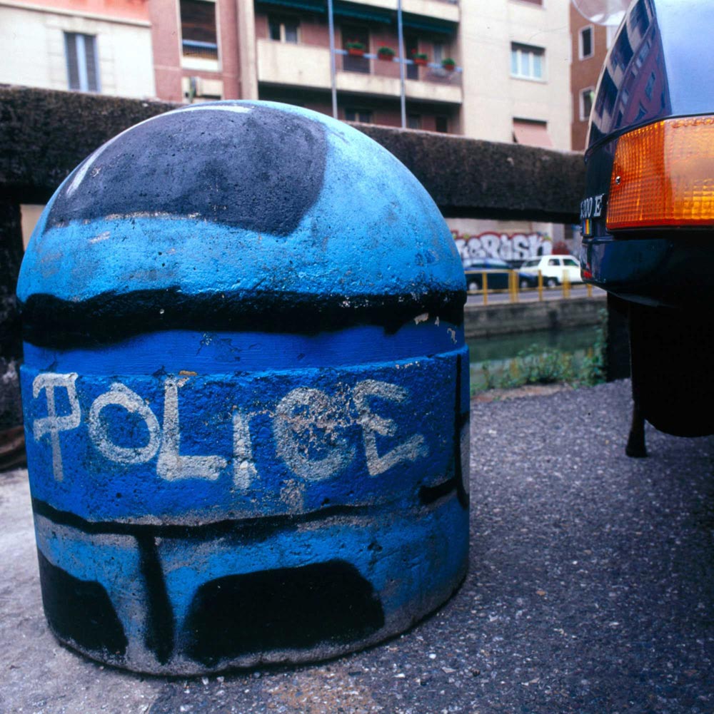 A Policeman painted on a street bollard by Pao