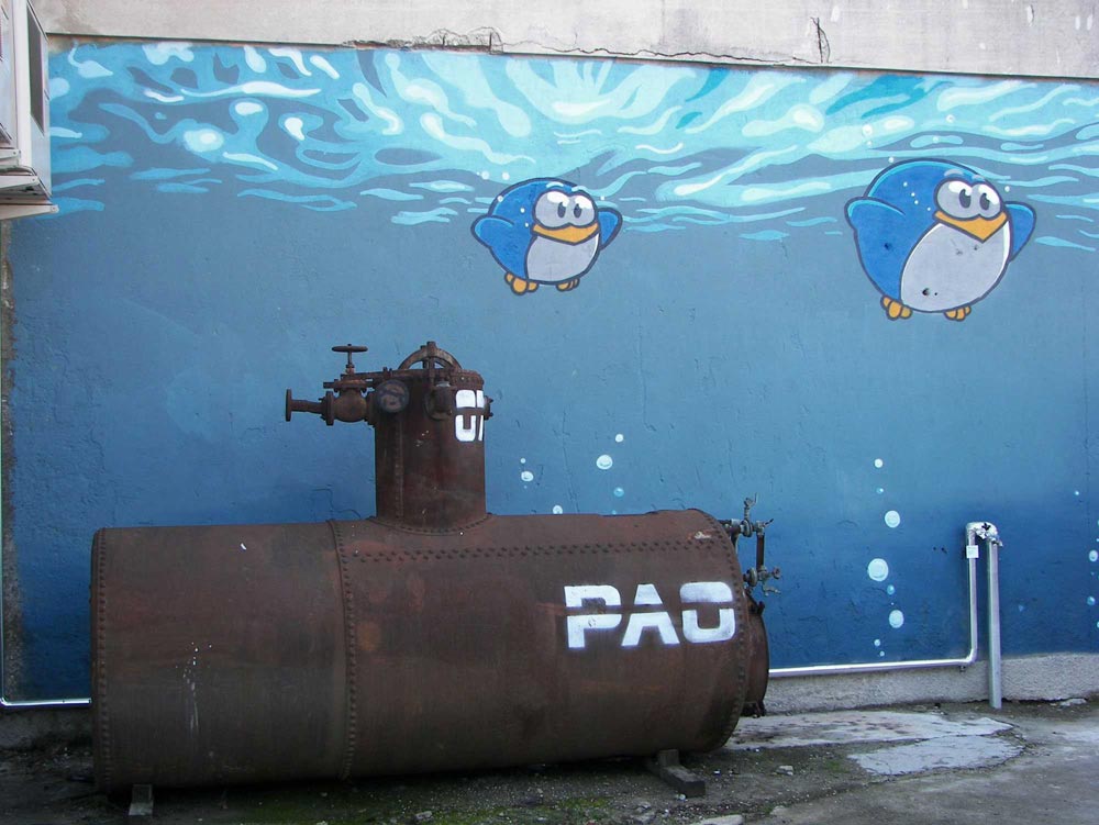 An old tank transformed in a submarine. Street art by Pao